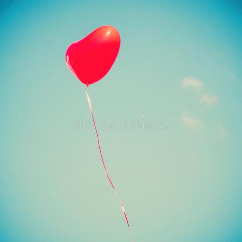 red-heart-shaped-balloon-flying-away-45976272.jpg